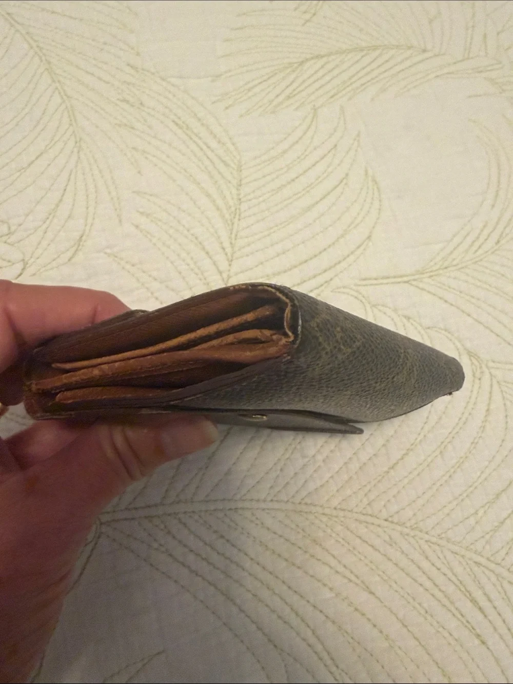 Louis Vuitton trifold snap wallet. Authentication provided.
